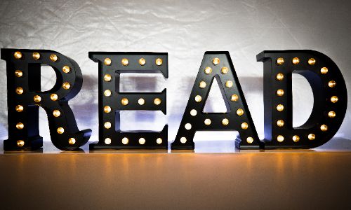 Light up sign that says READ.